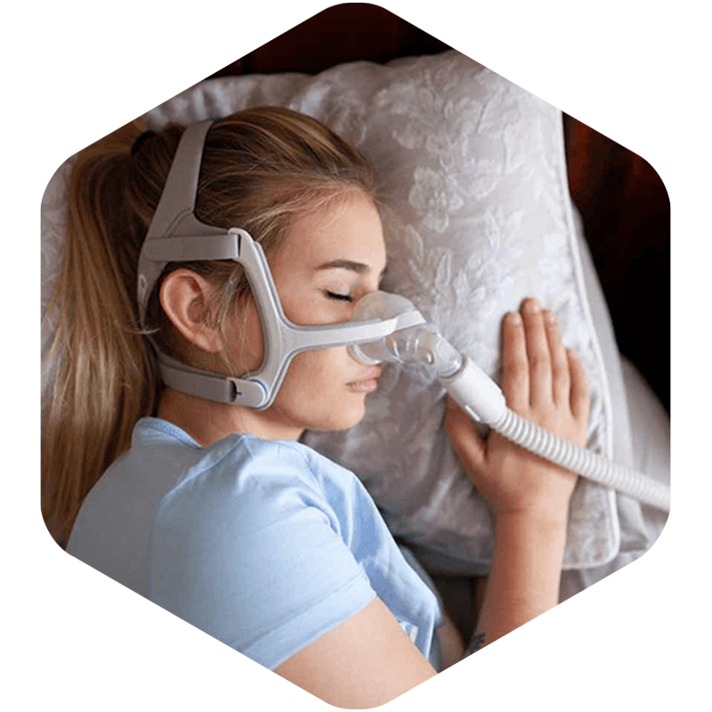 Female wearing CPAP device